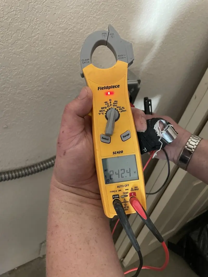 Voltage testing with clamp meter during Recessed Lighting Installation in Tarrytown